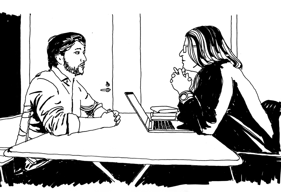 Man and woman in conversation in an office.